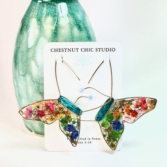 Butterfly hoop earrings with pressed flowers and Austrian crystals. Made by Chestnut Chic Studio.