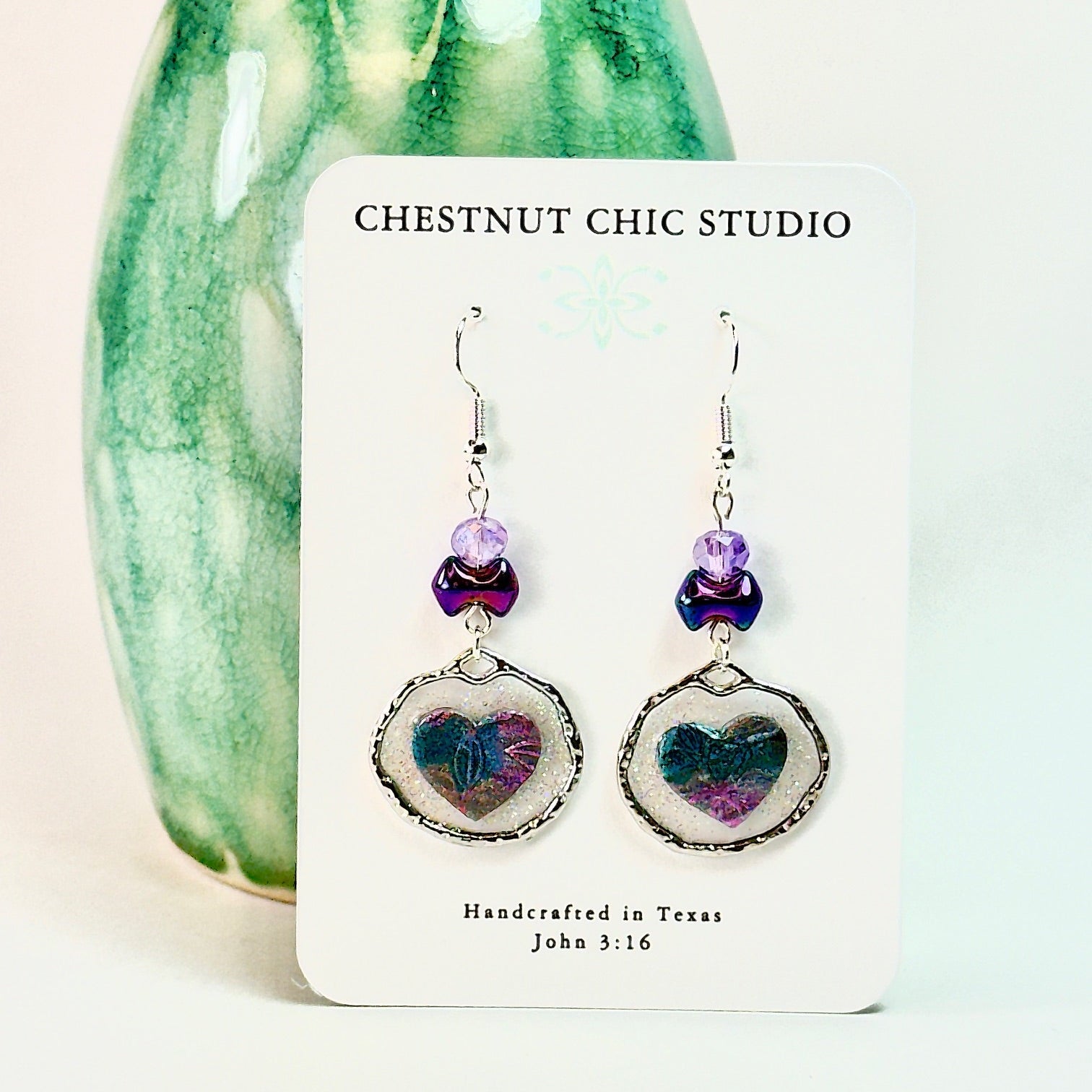 Purple Floating Heart Earrings in Silver on white card