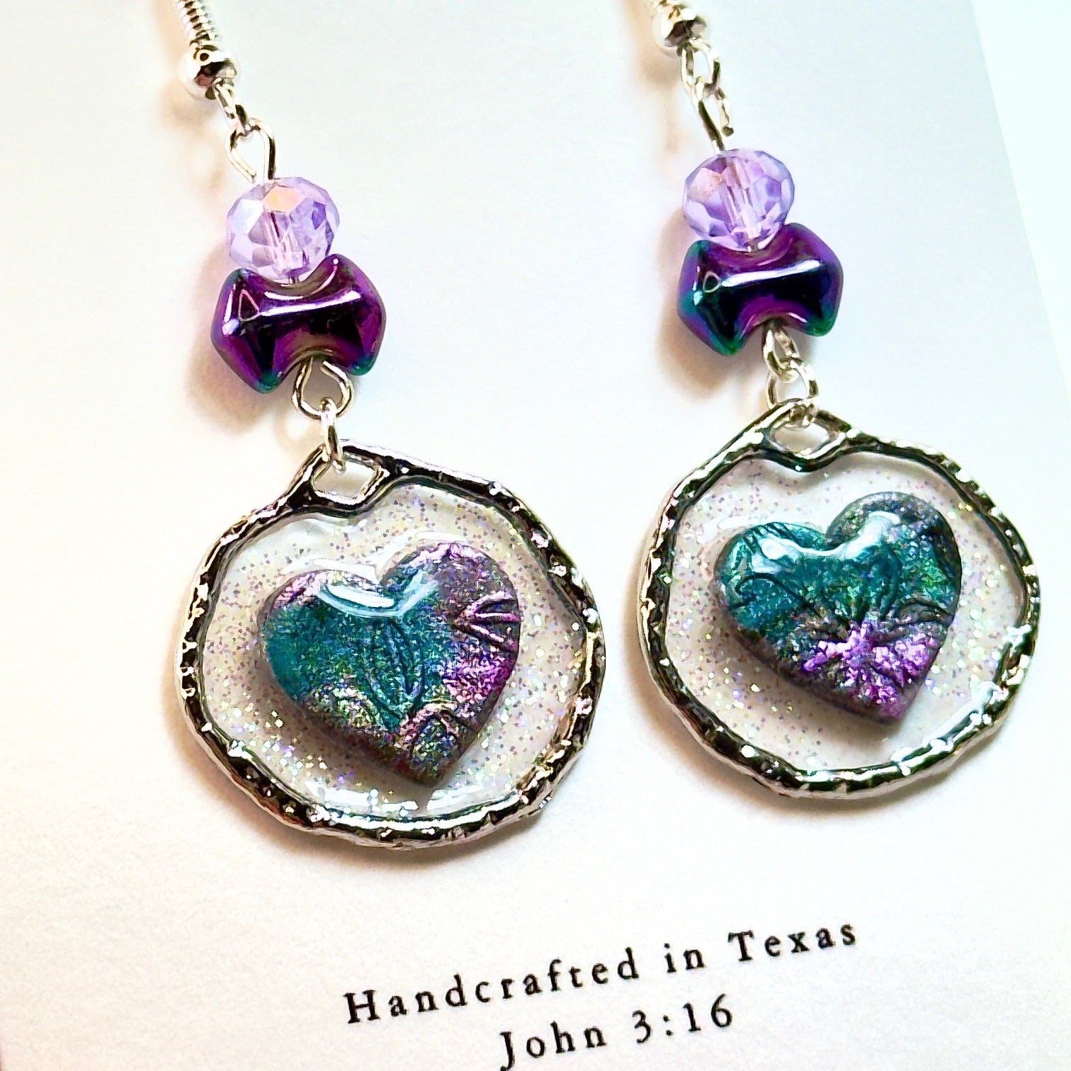 Purple Floating Heart Earrings in Silver on white card
