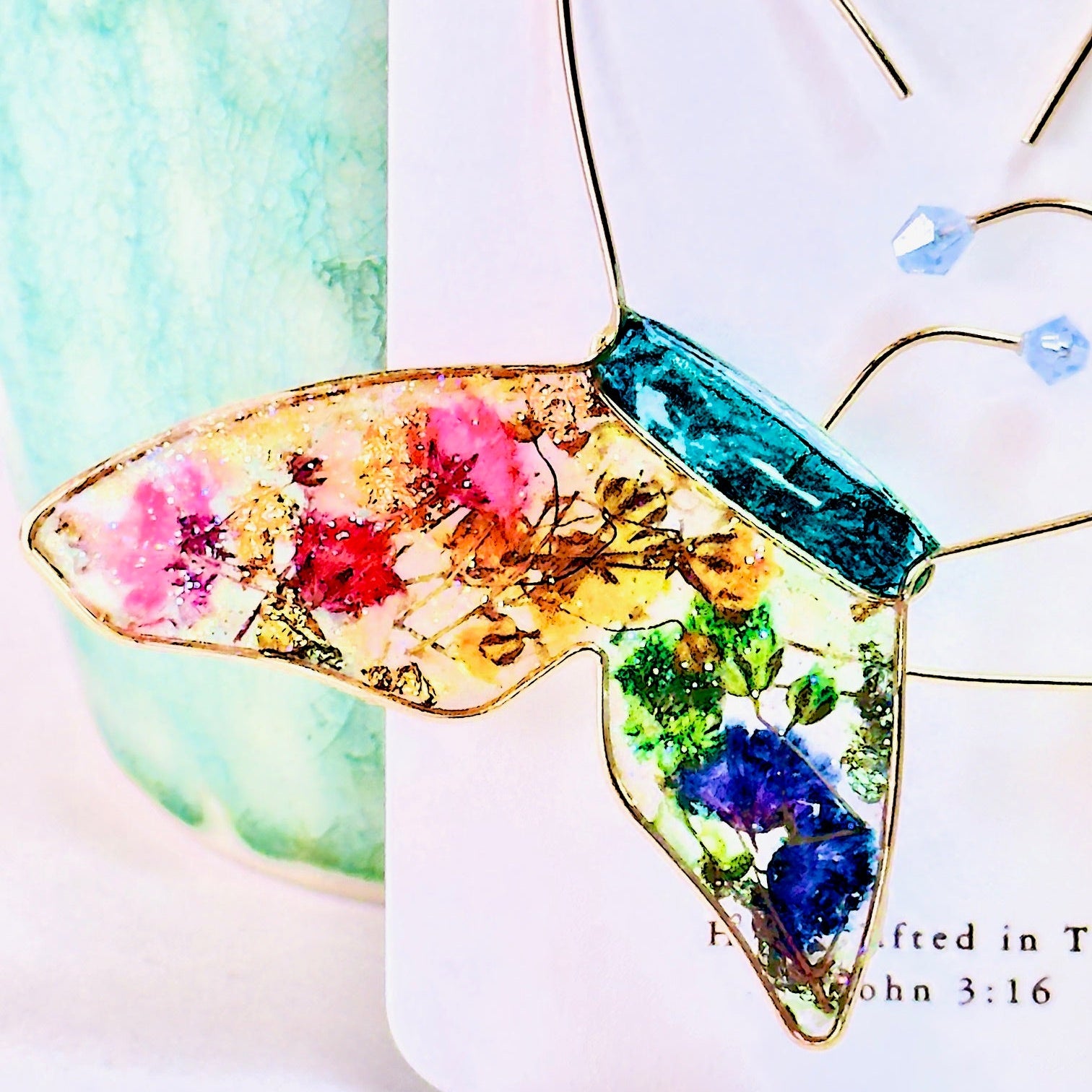 Butterfly hoop earrings with pressed flowers and Austrian crystals. Made by Chestnut Chic Studio.