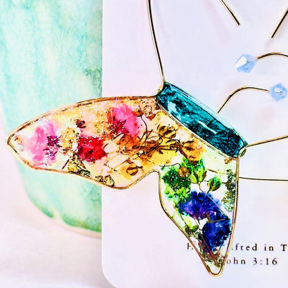 Butterfly hoop earrings with pressed flowers and Austrian crystals. Made by Chestnut Chic Studio.
