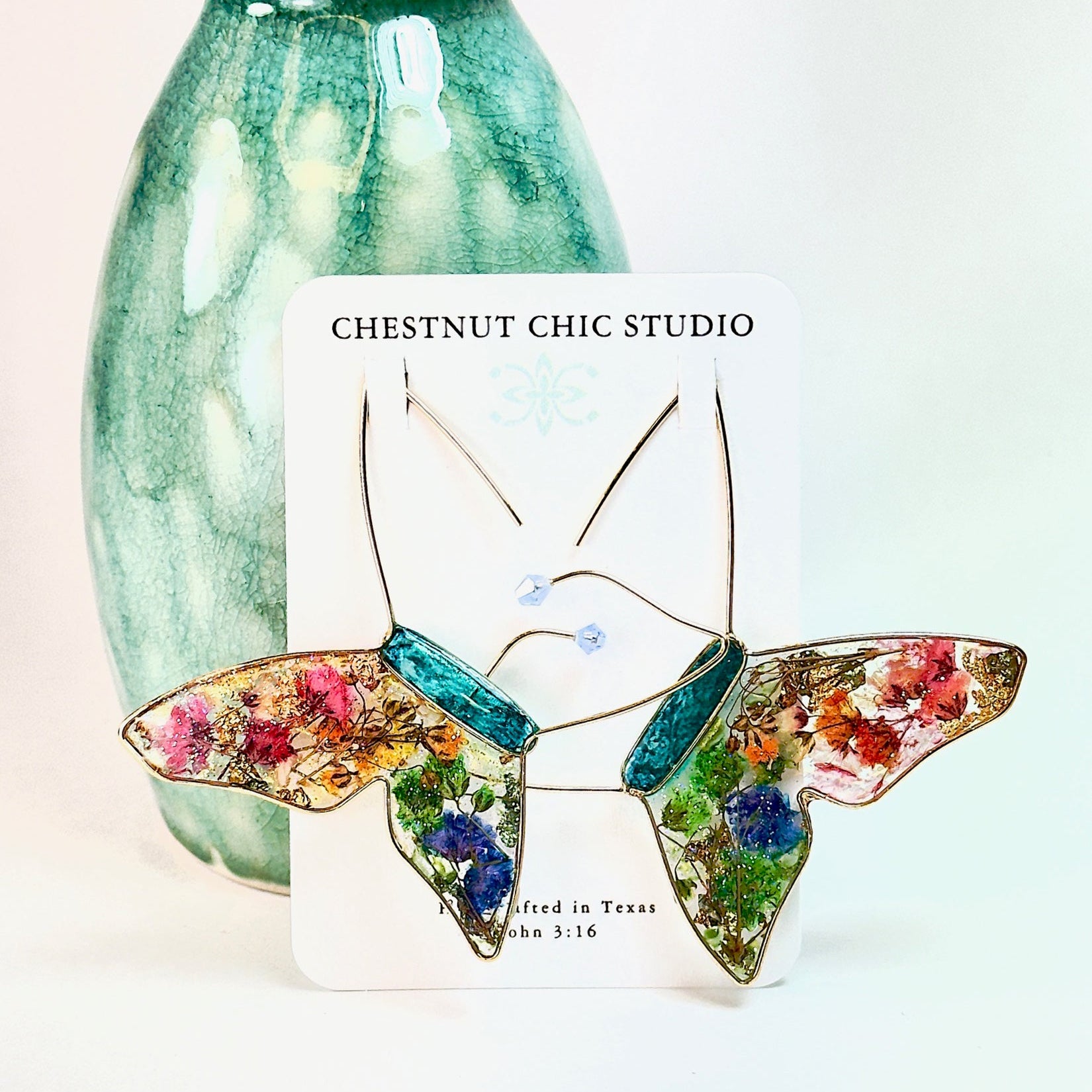 Butterfly hoop earrings with pressed flowers and Austrian crystals. Made by Chestnut Chic Studio.