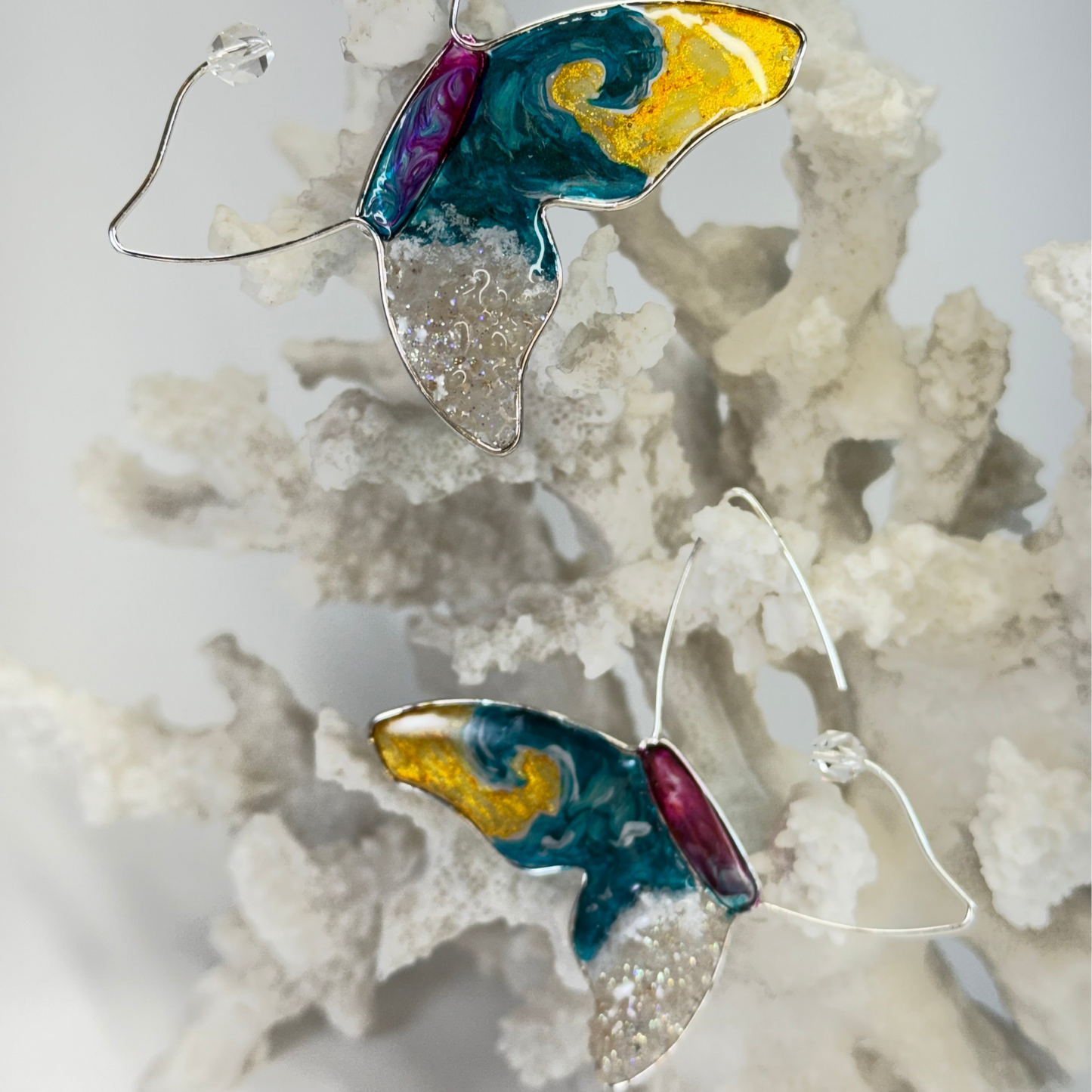 hand painted butterfly earrings with surf waves, real sand, and beachy vibes by chestnut chic studio