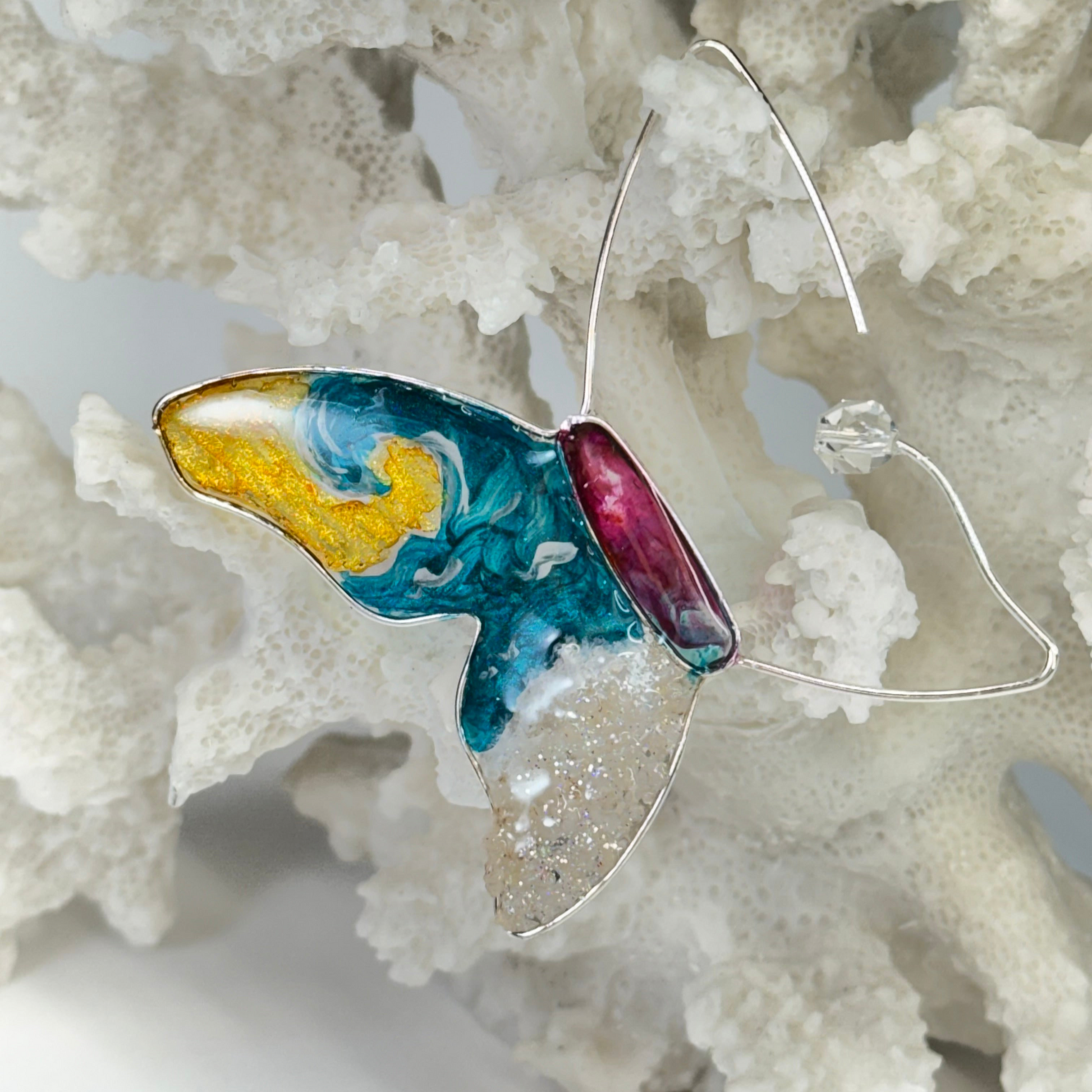 hand painted butterfly earrings with surf waves, real sand, and beachy vibes by chestnut chic studio