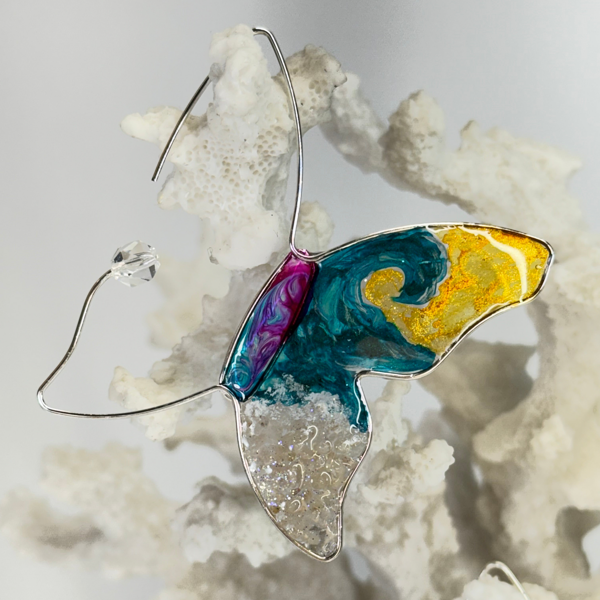 hand painted butterfly earrings with surf waves, real sand, and beachy vibes by chestnut chic studio