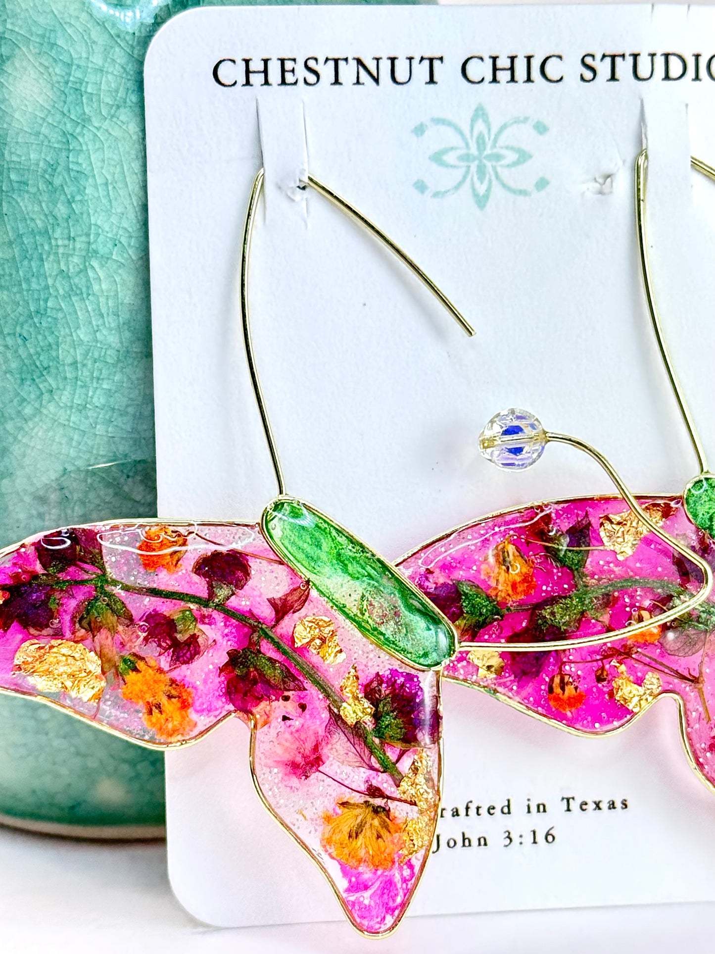 Couture design by Chestnut Chic Studio. Hand crafted artisan butterfly earrings with pressed botanicals of basil, with added touches of gold leaf.